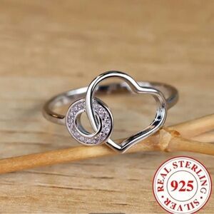 New, Feminine Sterling Silver Heart Ring through cubic zirconia circle. Sz. 9.5